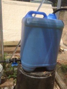 A head tank for the hydroponic arm of aquaponics systems is filled from the pond pump and feeds the plant pots.